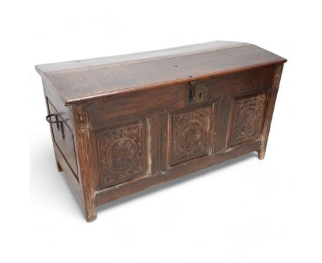 18th century carved oak coffer or chest, sloped hinged lid over panelled front, carved with three Northern European portraits