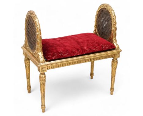 Late 19th century gilt wood and gesso window seat, raised oval cane work sides with lattice and ribbon decorated frame, recta