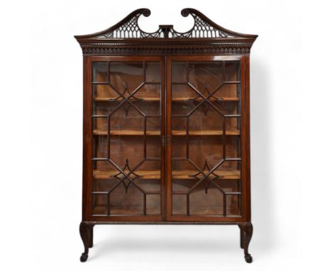 Large George III mahogany bookcase display cabinet, pierced swan neck pediment with floral head roundels over dentil and arca