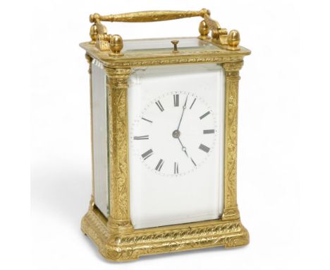 Auguste of Paris - mid-19th century carriage clock in a foliate engraved case with acorn finials and conforming carrying hand