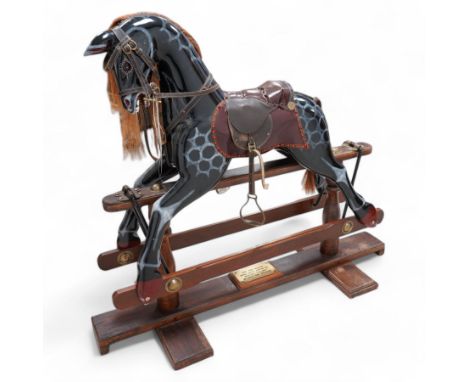 Retailed by Harrods - 'Millennium Limited Edition' rocking horse, dappled black finish with leather saddle and stirrups, on t