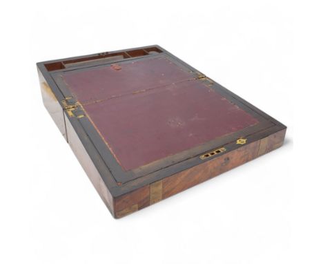 Victorian brass bound walnut writing slope, with brass escutcheon to the hinged cover, revealing an oxblood leather slope, an