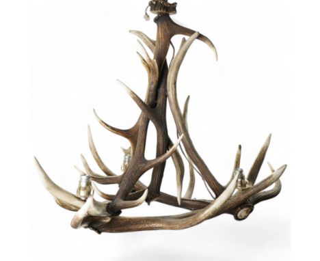 Deer antler chandelier, of triangular form, with three fitted lights H62cm