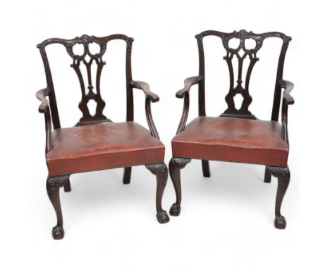 Early 20th century pair of Chippendale design mahogany elbow chairs, shaped cresting rail carved with foliate cartouches and 