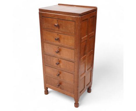 Mouseman - adzed oak pedestal chest, fitted with six drawers each with turned handle, panelled sides, on octagonal feet, by t