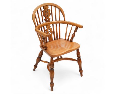 Elm child's Windsor armchair, double hoop and stick back with shaped pierced splat, dished seat on turned supports united by 
