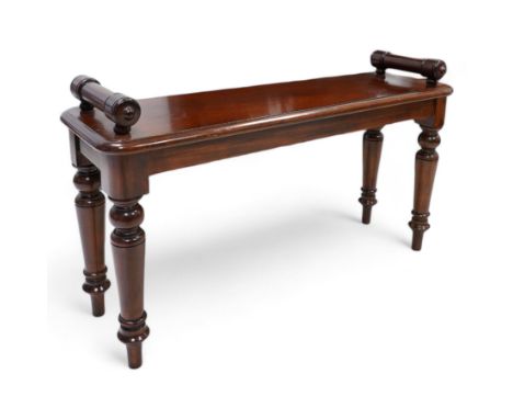 Victorian design mahogany hall bench or window seat, the moulded rectangular top mounted by turned bolster ends, on turned su