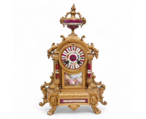 French - Late 19th century 8-day gilt metal and porcelain mounted clock c1880, the arched case above a plinth base on paw fee