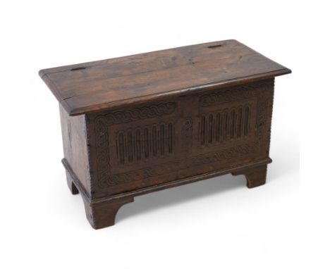 18th century and later plank kist, rectangular form, moulded hinged lid over guilloche and fluted front with chip carved edge