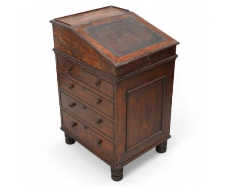 Early 19th century rosewood Davenport, sliding top section enclosed by moulded lid with leather inset, the interior fitted wi