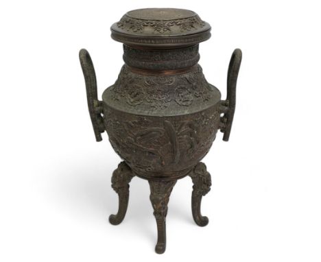 Large 19th century Japanese bronze koro, the ovoid body decorated in relief with phoenix and kylin amidst clouds, with two el