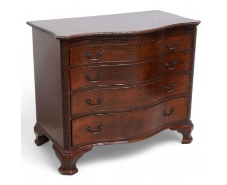 Early 20th century Chippendale design mahogany serpentine chest, shaped moulded top carved with repeating flower head motifs,
