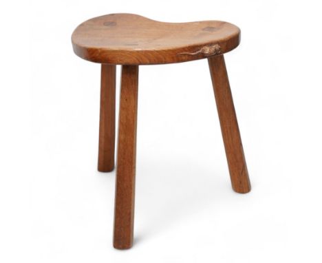 Mouseman - oak kidney-shaped stool, on three tapered octagonal supports, carved with moues signature, by the workshop of Robe