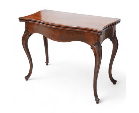 George III inlaid mahogany card table of serpentine form, the shaped rectangular fold-over top decorated with cross-banding a