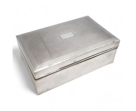 Large rectangular silver cigar box with engine turned hinged cover, vacant cartouche and divided interior 26cm x 16cm marks r