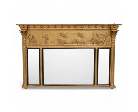 Regency gilt overmantle mirror, inverted breakfront pediment decorated with applied gilt spheres, the relief frieze depicting