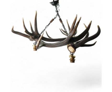 Deer antler chandelier, of triangular form, with three fitted hanging lights H45cm