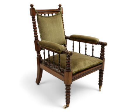 Late Victorian walnut bobbin turned armchair, curved cresting rail with bead moulding over turned spindle back, upholstered a