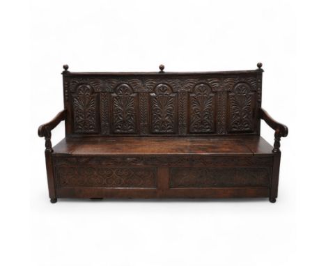 18th century oak settle or bench, moulded cresting rail with globular finials over five panel back, each stepped arch panel c