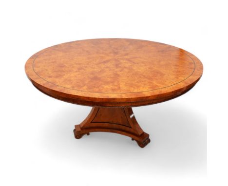 Regency design figured elm centre table, circular top with segmented veneers and ebony band, the frieze decorated with applie