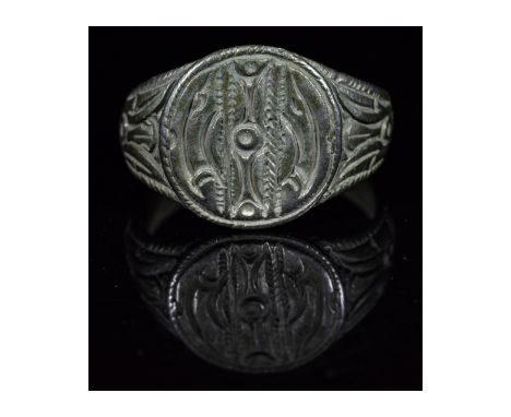 Ca.900-1100 AD. Interesting wearable Viking Silver Ring with runic symbols, rapresenting the sun in the middle, two stylized 