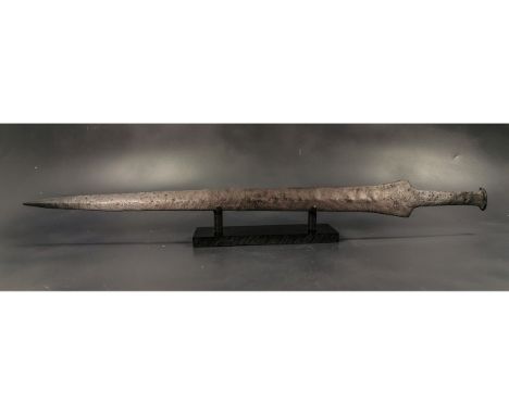 Ca. 300 BC. Rare well-preserved Celtic or Thracian double-edged iron sword a, with a hammered flat tangsmall pommel. The blad