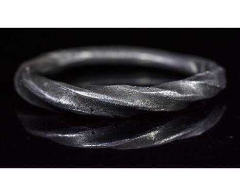 Ca.900 AD. Attractive Silver Finger Ring formed as a single tapering rod with twisted bezel. Good Condition; wearable; Inner 