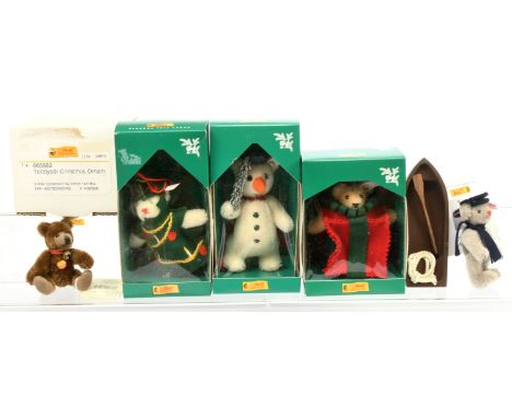 Steiff group including: (1) All Wrapped Up Christmas Ornament teddy bear, white tag 665882, LE 5000, mohair, swing label cert