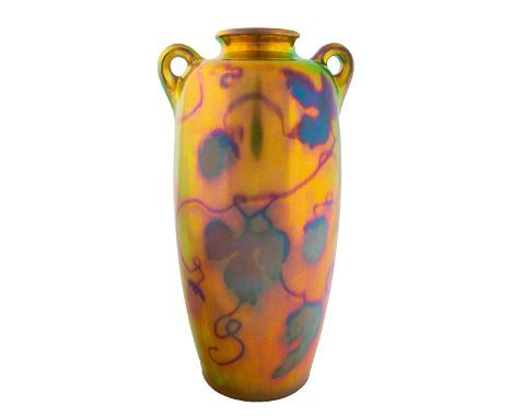 A HUNGARIAN EOSIN-GLAZED TWO-HANDLED 'GRAPE LEAF' VASE, ZSOLNAY PORCELAIN FACTORY, PECS, CIRCA 1900-1910the slightly tapered 