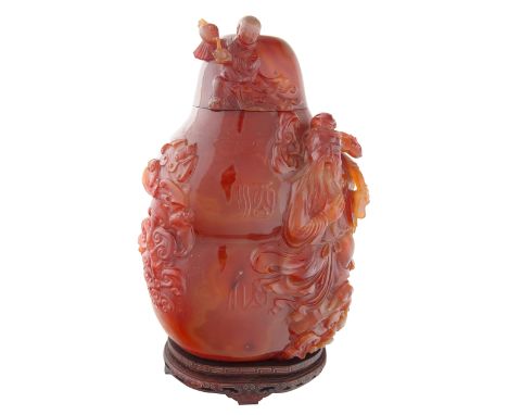 A FINE CHINESE CARNELIAN AGATE VESSEL WITH COVER, QING DYNASTY, LATE 19TH CENTURYof flattened double gourd form, applied with