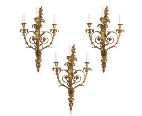 A SET OF THREE ORMOLU CANDELABRA WALL MOUNTS, LATE 19TH-EARLY 20TH CENTURYcomprising of a trio of three-light candelabra mode