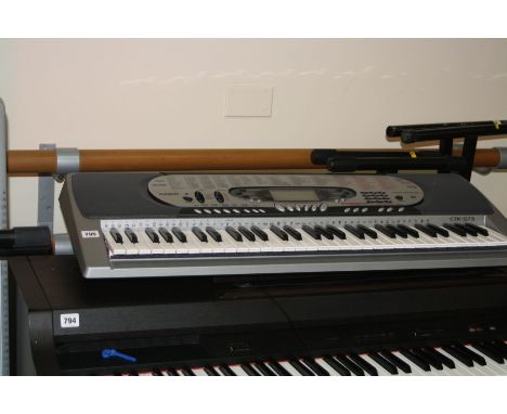 A CASIO CTK-573 ELECTRONIC KEYBOARD, and two keyboard stands 