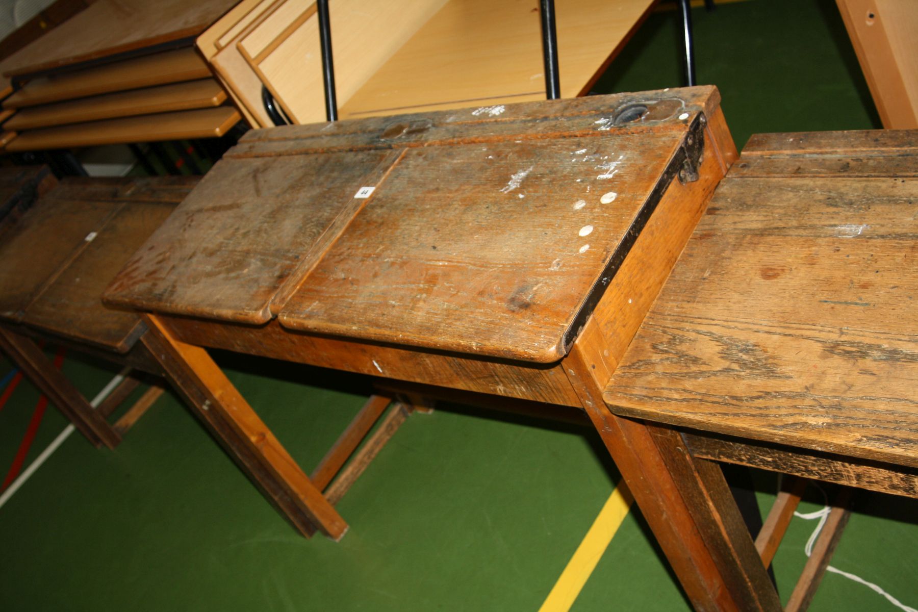 A VINTAGE DOUBLE SCHOOL DESK, with oak top, two lift up lids, two
