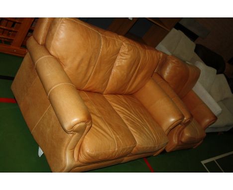 AN ANTIQUED FAWN LEATHER TWO PIECE SUITE, consisting of a two seater sofa (147cm wide) and an arm chair (90cm wide) (s.d)