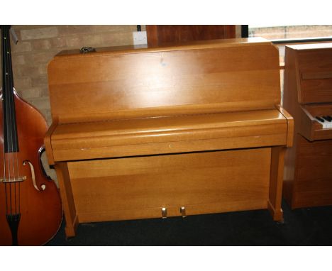 A ZENDER UPRIGHT PIANO, with a light oak case 135x112cm high (s.d)