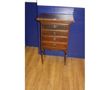 AN ART NOUVEAU MAHOGANY MUSIC CABINET, with four drawers (adapted to be fixed front) holding heart shaped copper and brass dr