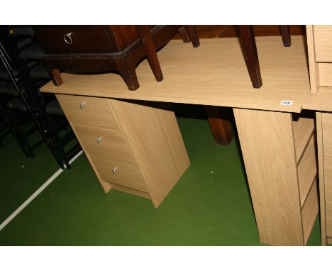 A MODERN OAK EFFECT DESKS, with three drawers to the left and a three shelf bookcase to the right 120x49x73cm high (s.d)