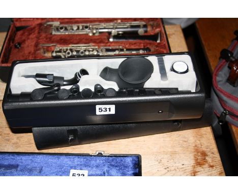A NUVO PLASTIC CLARINET, in an ABS case