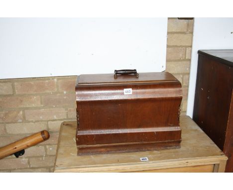 A JONES WALNUT CASED MANUAL SEWING MACHINE, 43x23x33cm high