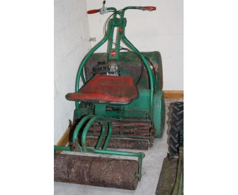 A WEBB IC3.5HP PETROL CYLINDER MOWER, with 24'' cut and seated roller attachment 