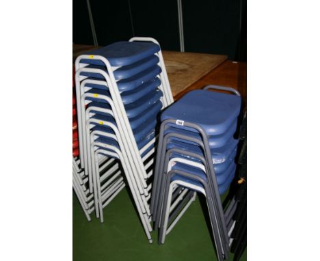 ELEVEN STACKING CLASSROOM STOOLS, with blue plastic shaped seats on a light grey tubular metal base 52cm high and four with m