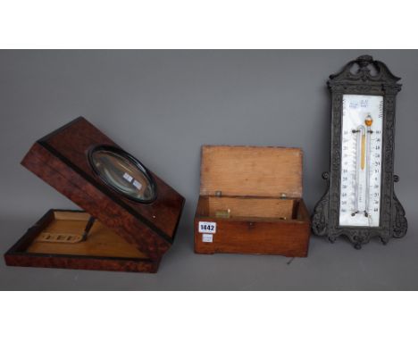 A Czechoslovakian cylinder music box of small proportions by F. Rzehitschek Prag, 21.5cm wide, a French metal and enamel wall