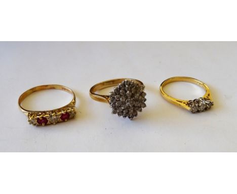 A 9ct gold and diamond set hexagonal cluster ring, an 18ct gold and diamond set three stone ring, claw set with a row of circ