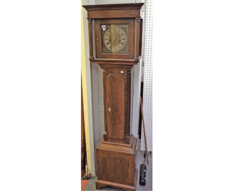 An 8 day longcase clock with 8 inch square brass engraved  dial and a waisted oak case, 170cm high, (cast iron weight &amp; p