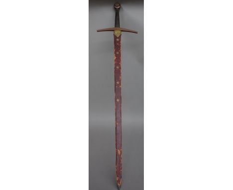 A 20th century ceremonial broad sword with double edged steel blade, 91cm, cross guard hilt, wire bound grip and lions head d