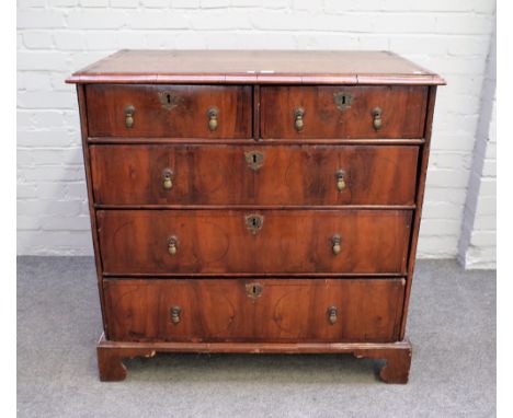 An early 18th century figured walnut chest with two short over three long graduated drawers on bracket feet, 96cm wide x 94cm