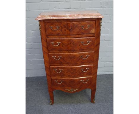 An 18th century French style petite commode, the serpentine marble top over a floral marquetry gilt metal mounted kingwood fi