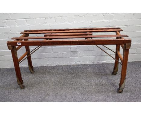 BT TUB BENCH FOR BEATTY BROS LIMITED FERGUS CANADA; a pitch pine and ash folding luggage stand, 108cm wide x 56cm high. 