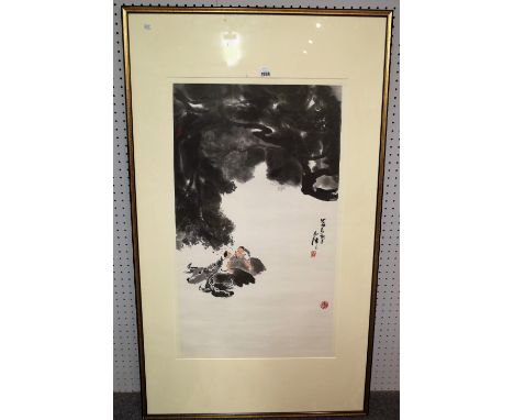 A Chinese print after Li Keran, modern, depicting two boys seated on water buffaloes, 88cm. by 50cm., framed and glazed.