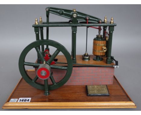 A model of a six column beam engine, modern mounted on a mahogany rectangular base, brass plaque titled 'Six column Beam Engi